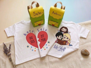 Personalized Christian and family-themed t-shirts displayed with handmade gift packaging.
